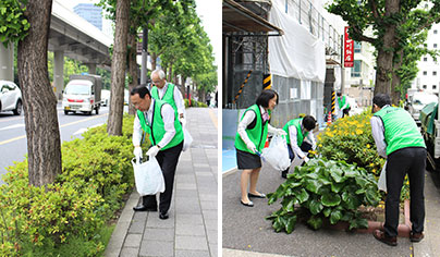 ゴミ拾いをする高荒常務（手前）と助川常務、職員ら